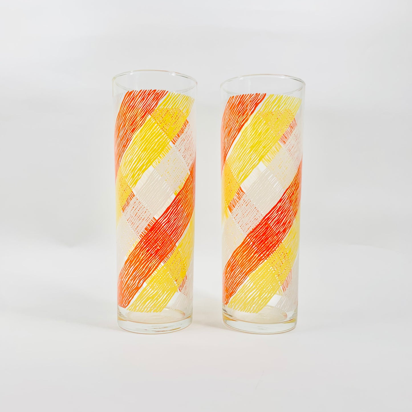 Tall 1970s orange laminated waves pattern highball glasses