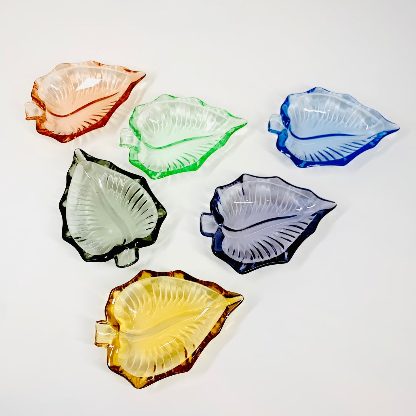 Midcentury harlequin pressed glass leaf shape side plate