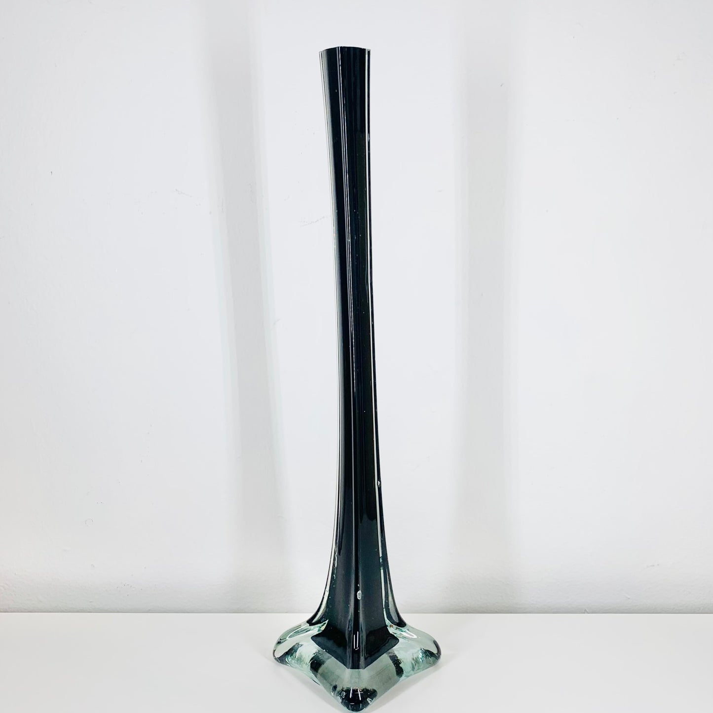 Very tall midcentury black glass vase