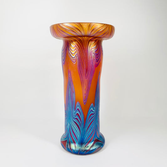 Mouth blown peacock orange and blue iridescent Art Nouveau style glass vase
