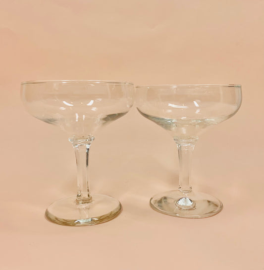 Antique glass champagne coupe with faceted stem