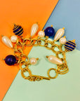 1980s costume gold plated charm bracelet with pearls & blue beads