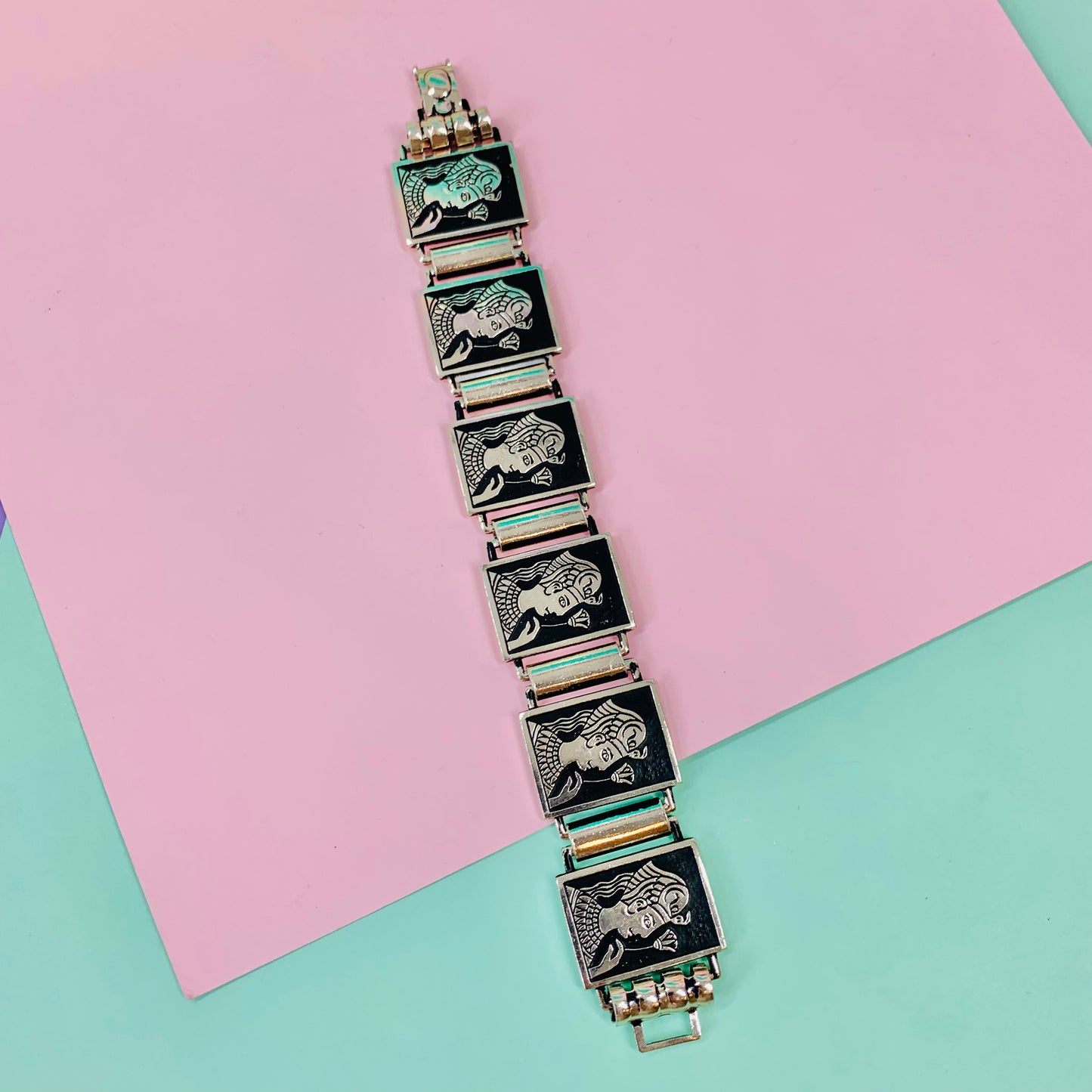Vintage aluminium enamel bracelet with female holding flower motif