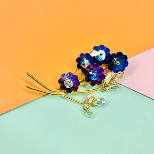 1970s gold plated flower bouquet brooch with iridescent purple Swarovski crystal flowers