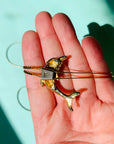 Rare 1970s gold plated with purple enamel dolphin slider bolo necklace