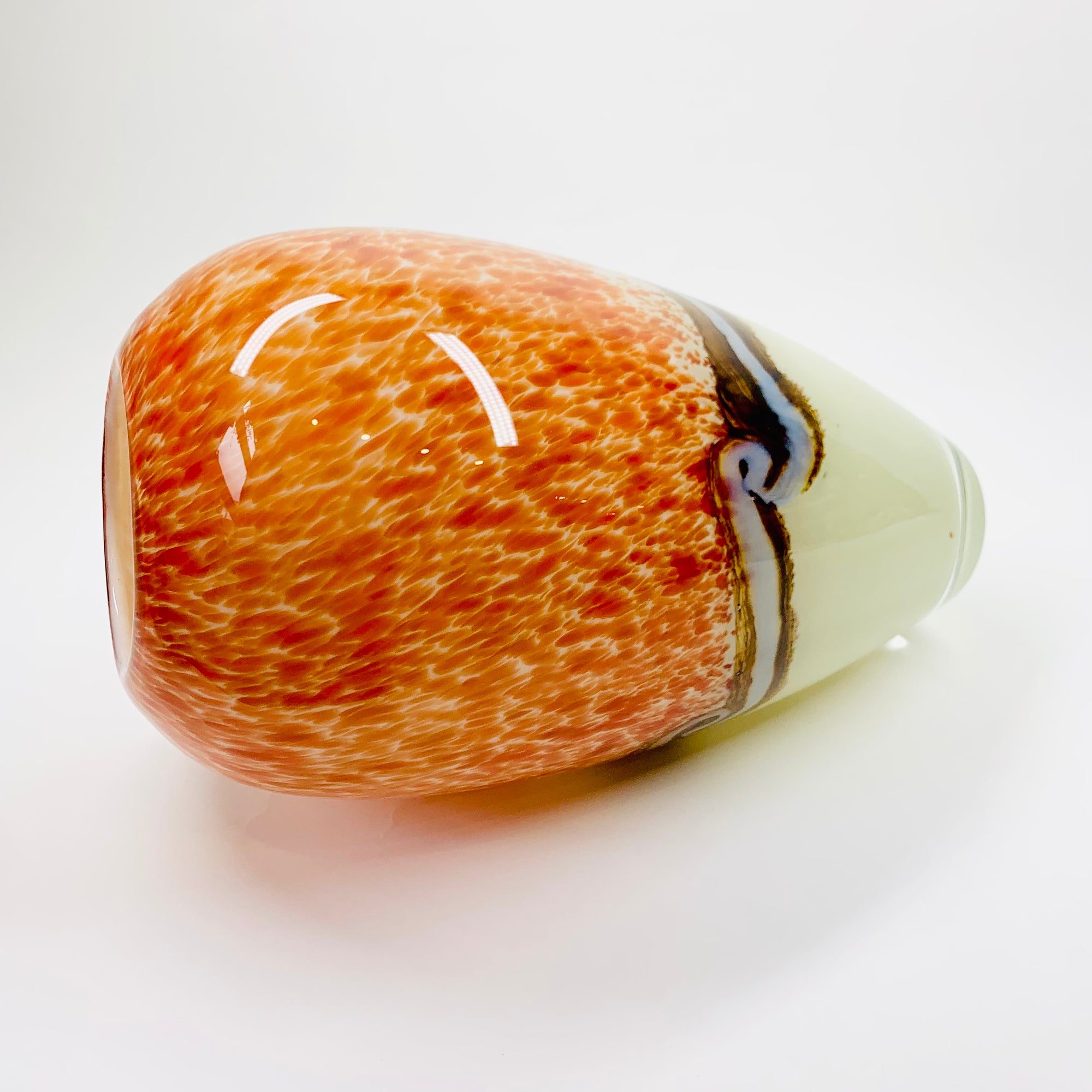 Vintage hand made orange cased art glass vase with abstract pattern