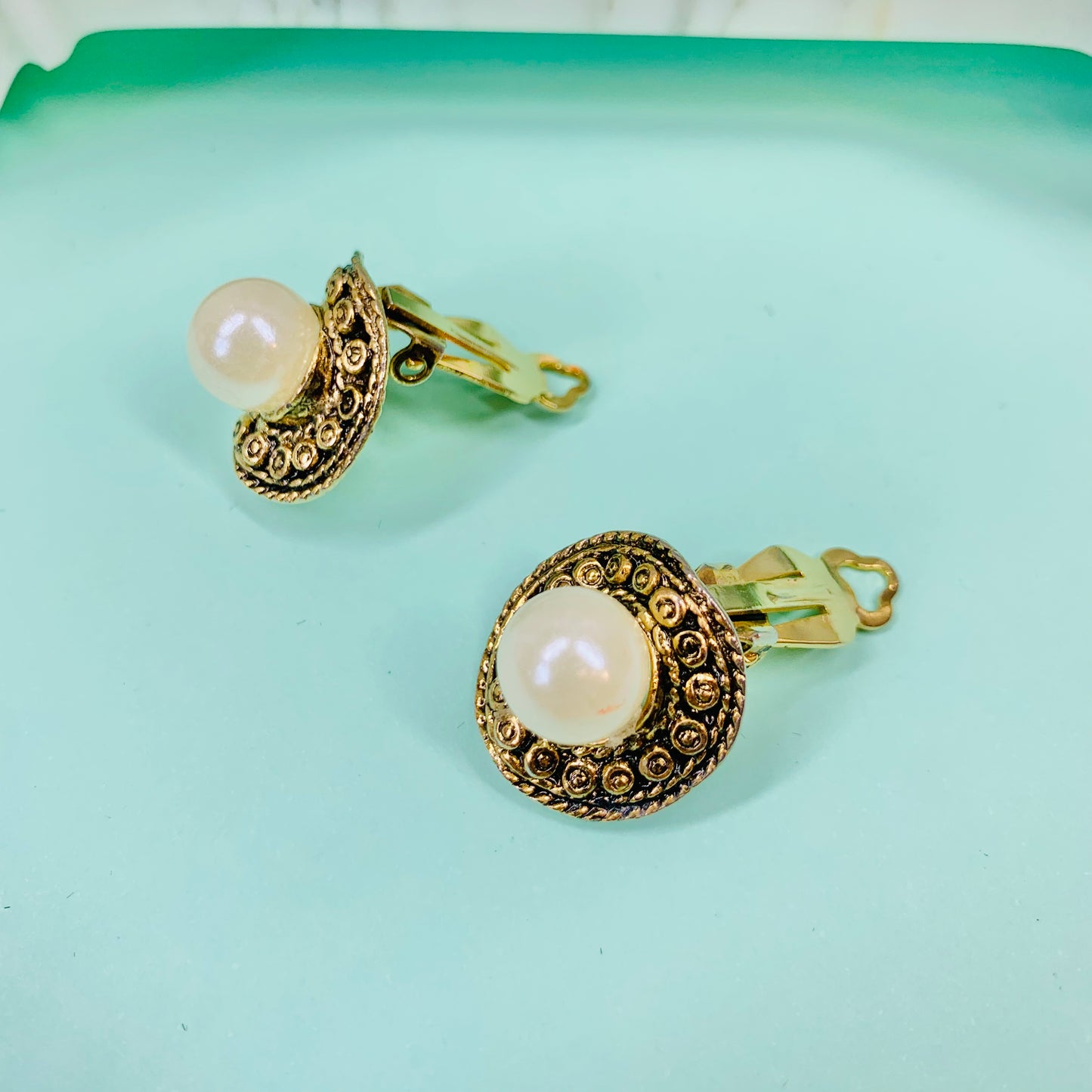 1960s gold plated filigree clip on pearl button earrings with filigree border