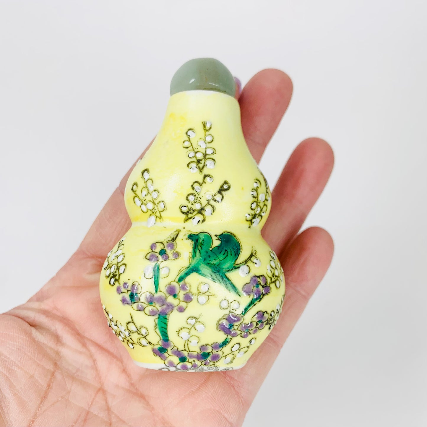 Antique Chinese hand painted yellow porcelain snuff bottle with jade stopper