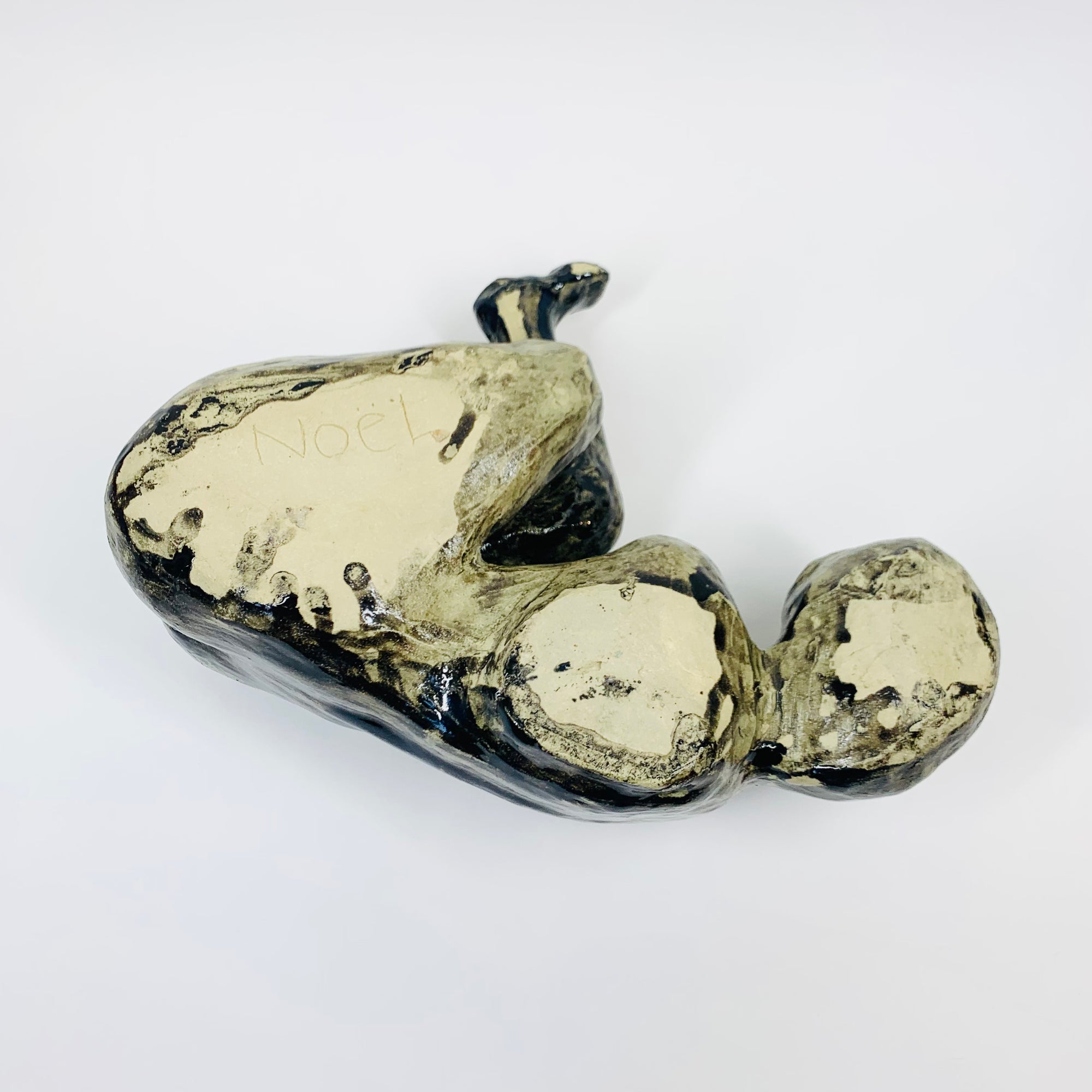 Australian pottery sculpture depicting woman clutching her stomach