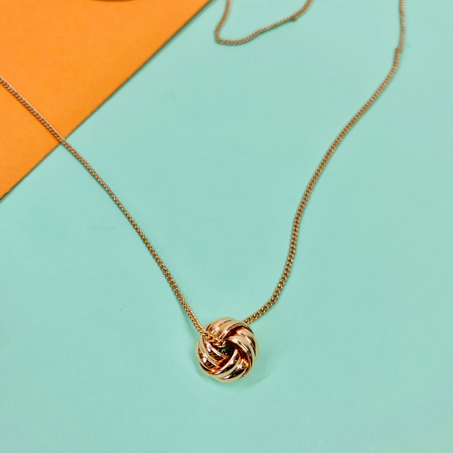 Vintage rose gold plated necklace with knot ball pendant