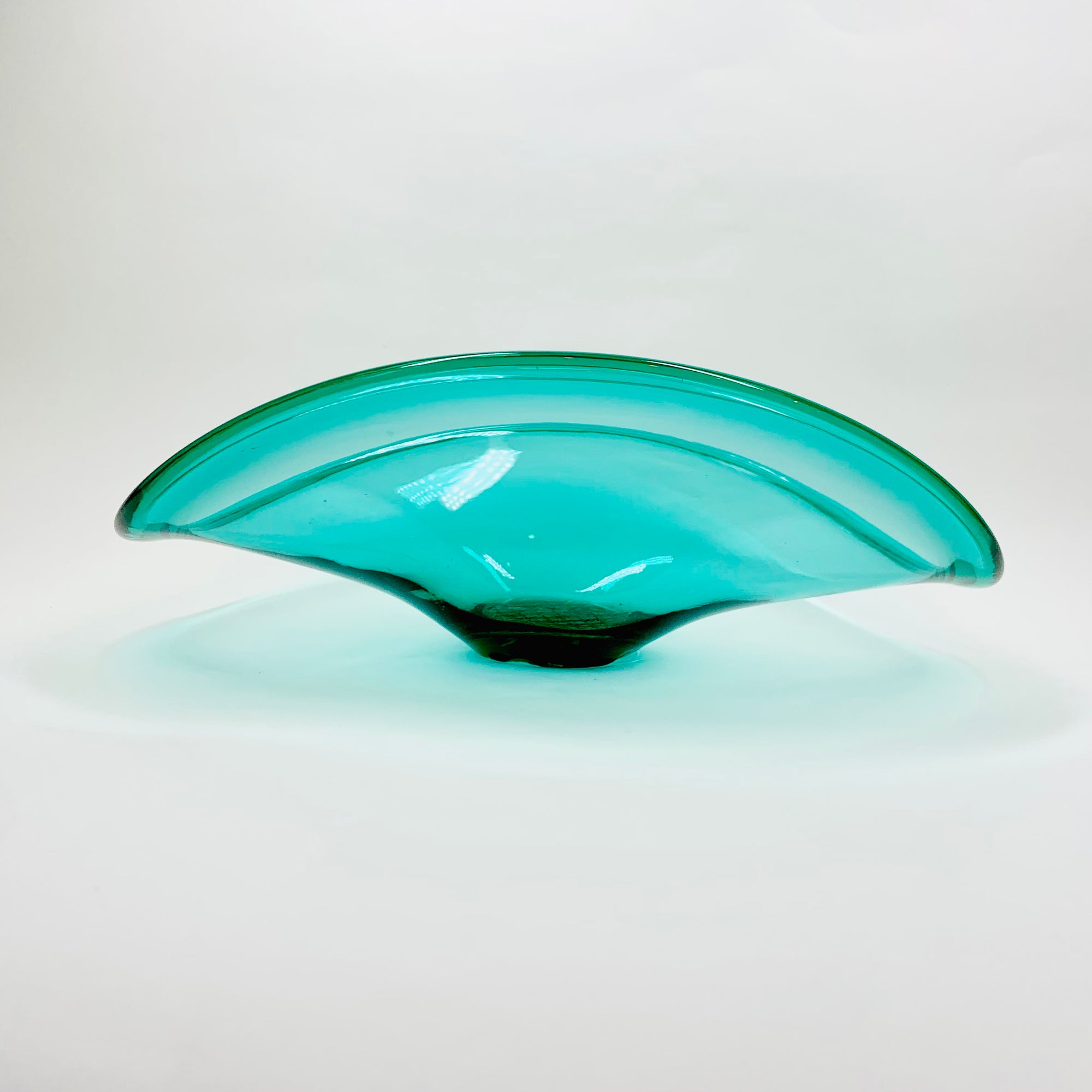 Vintage large hand made turquoise glass wave bowl with crisscross base