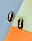 Stunning 1960s gold plated clip on black enamel earrings with rhinestones