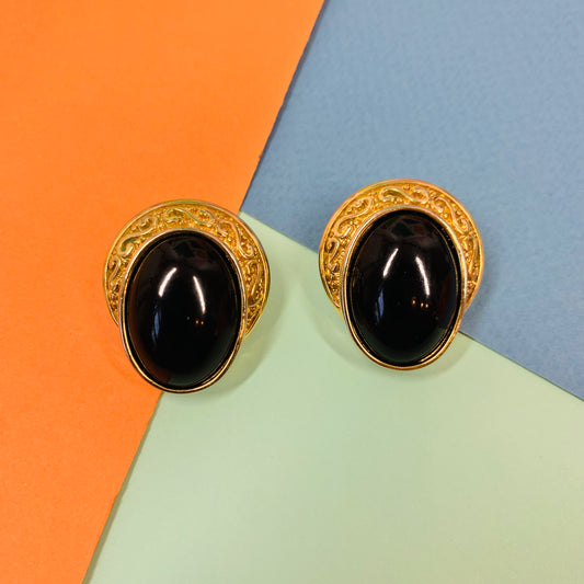 1960s brass clip on earrings with black bead center stone and filigree