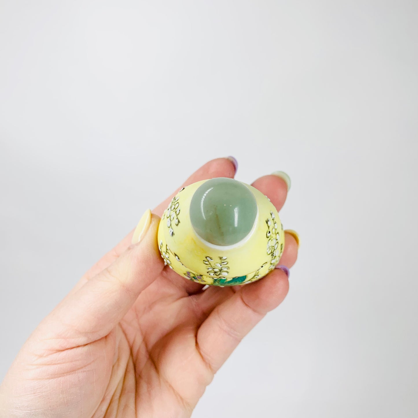 Antique Chinese hand painted yellow porcelain snuff bottle with jade stopper