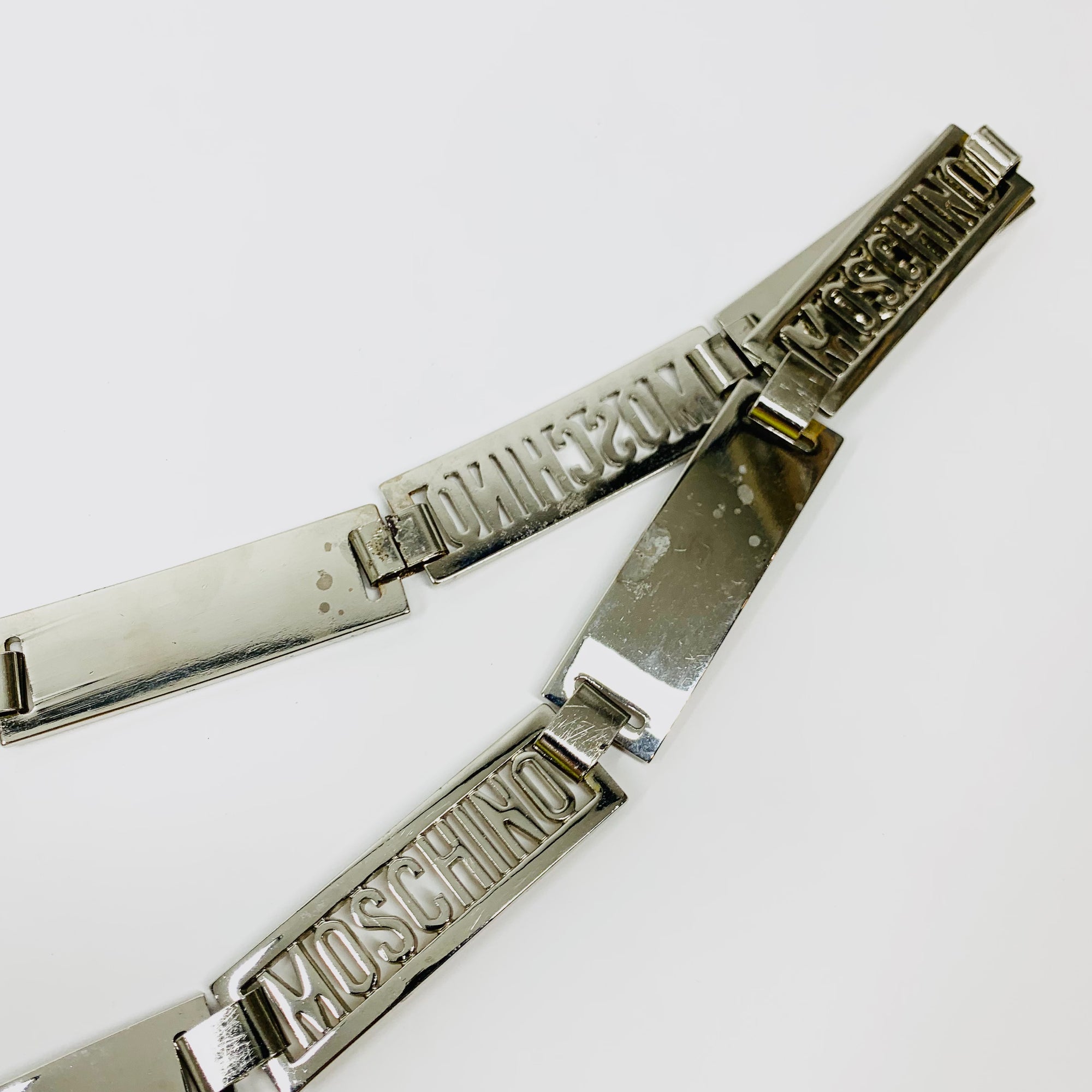 1980s MOSCHINO STAINLESS STEEL LOGO BAR BELT