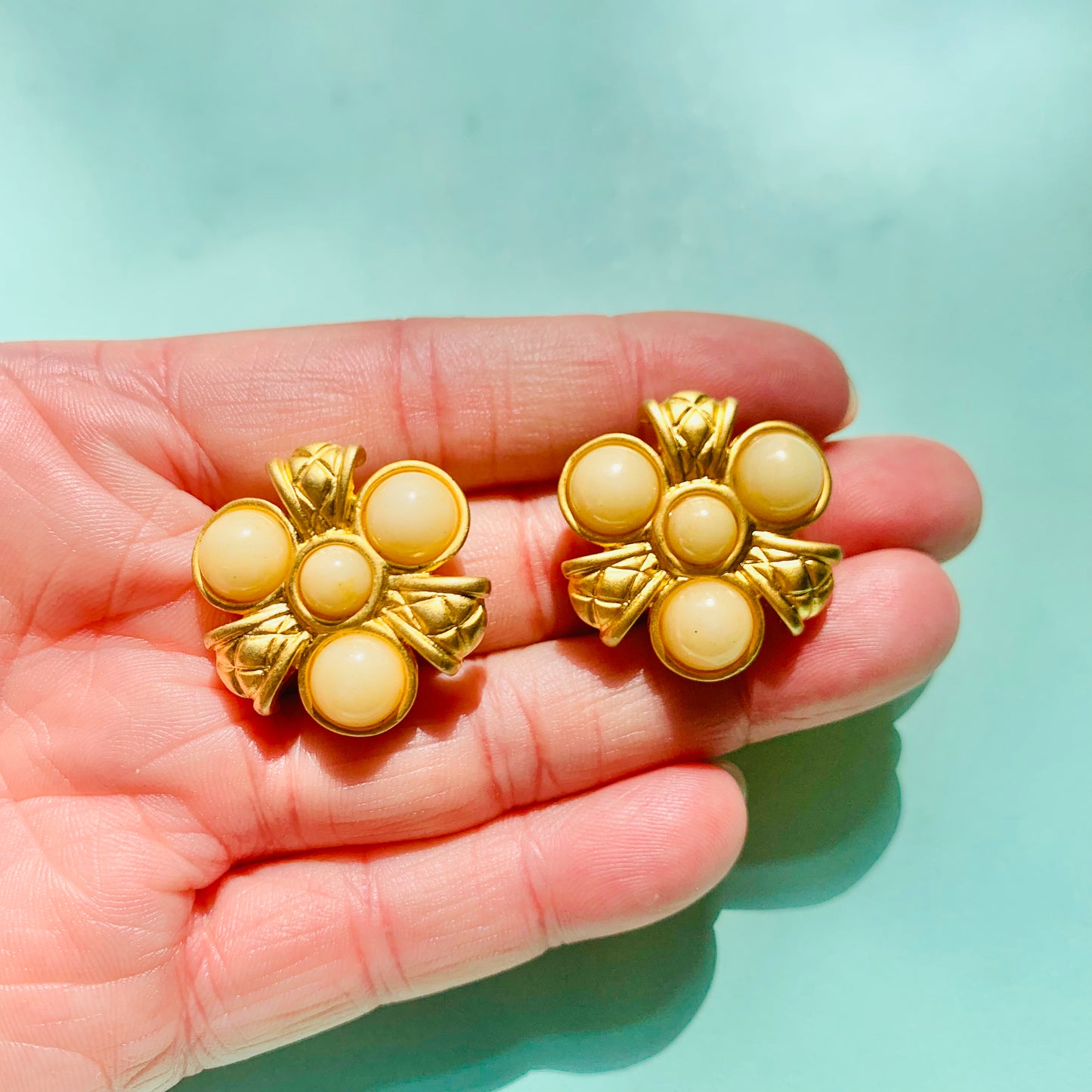 Rare 1980s matte triple gold plated gold matte pearl flower clip on earrings by Monet