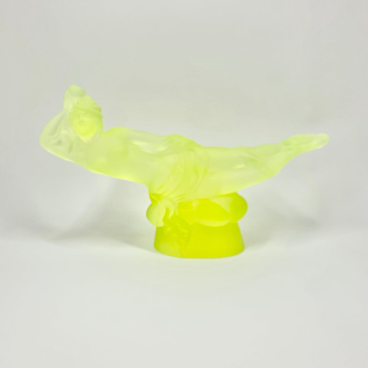 Art Deco reproduction of Lalique lie down Nude with star bangle cape figurine in uranium glass