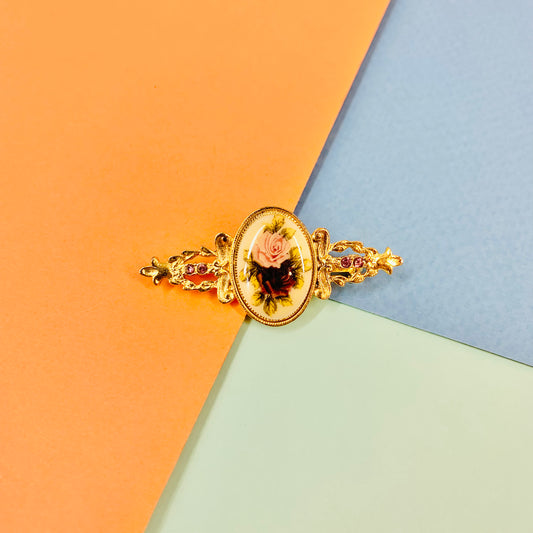 Antique gilt metal costume brooch with floral resin