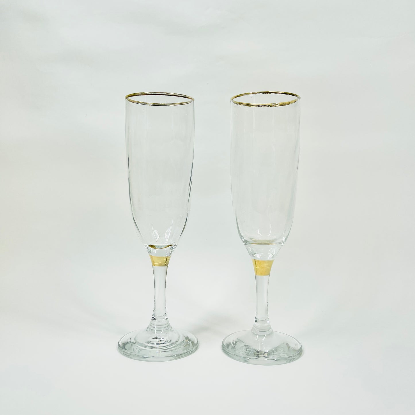 Midcentury Bohemian clear glass champagne flutes with gold gilding