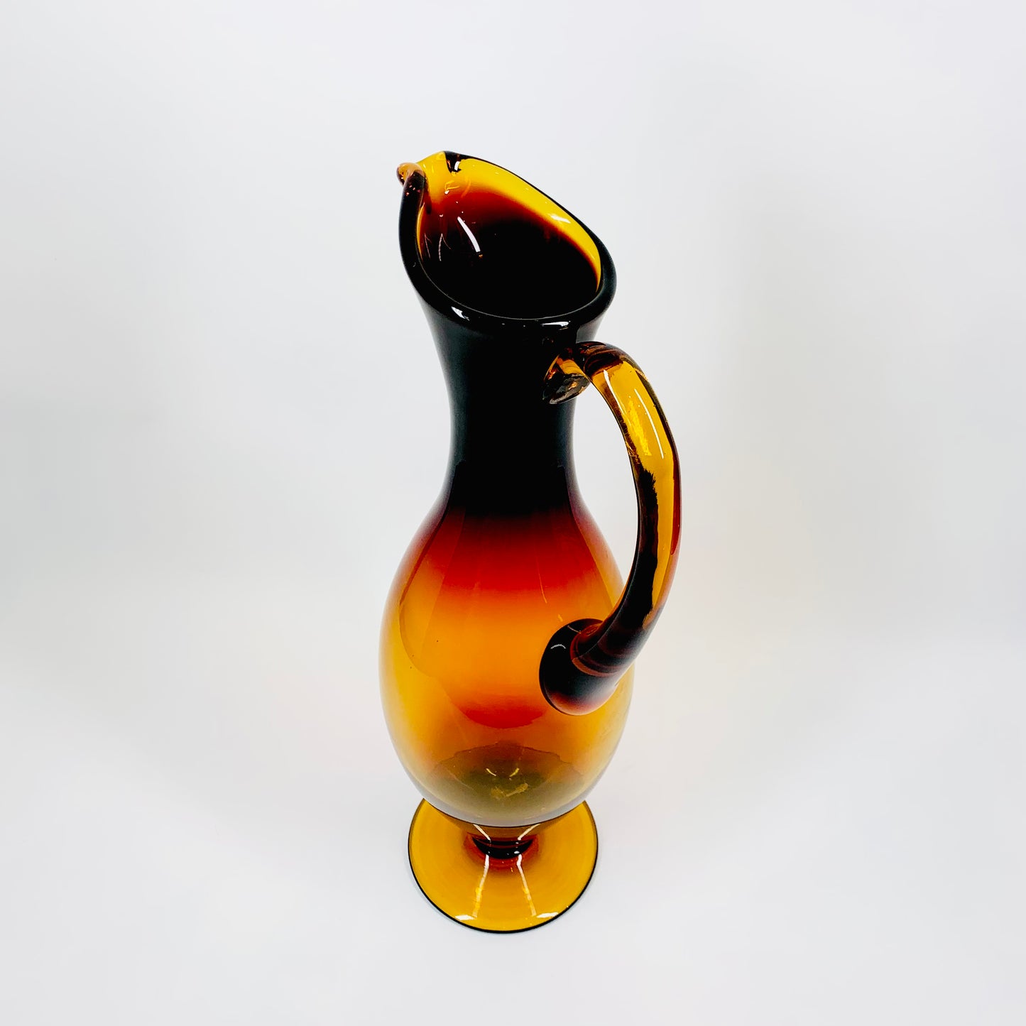 Tall Midcentury American Bischoff amberina glass footed jug