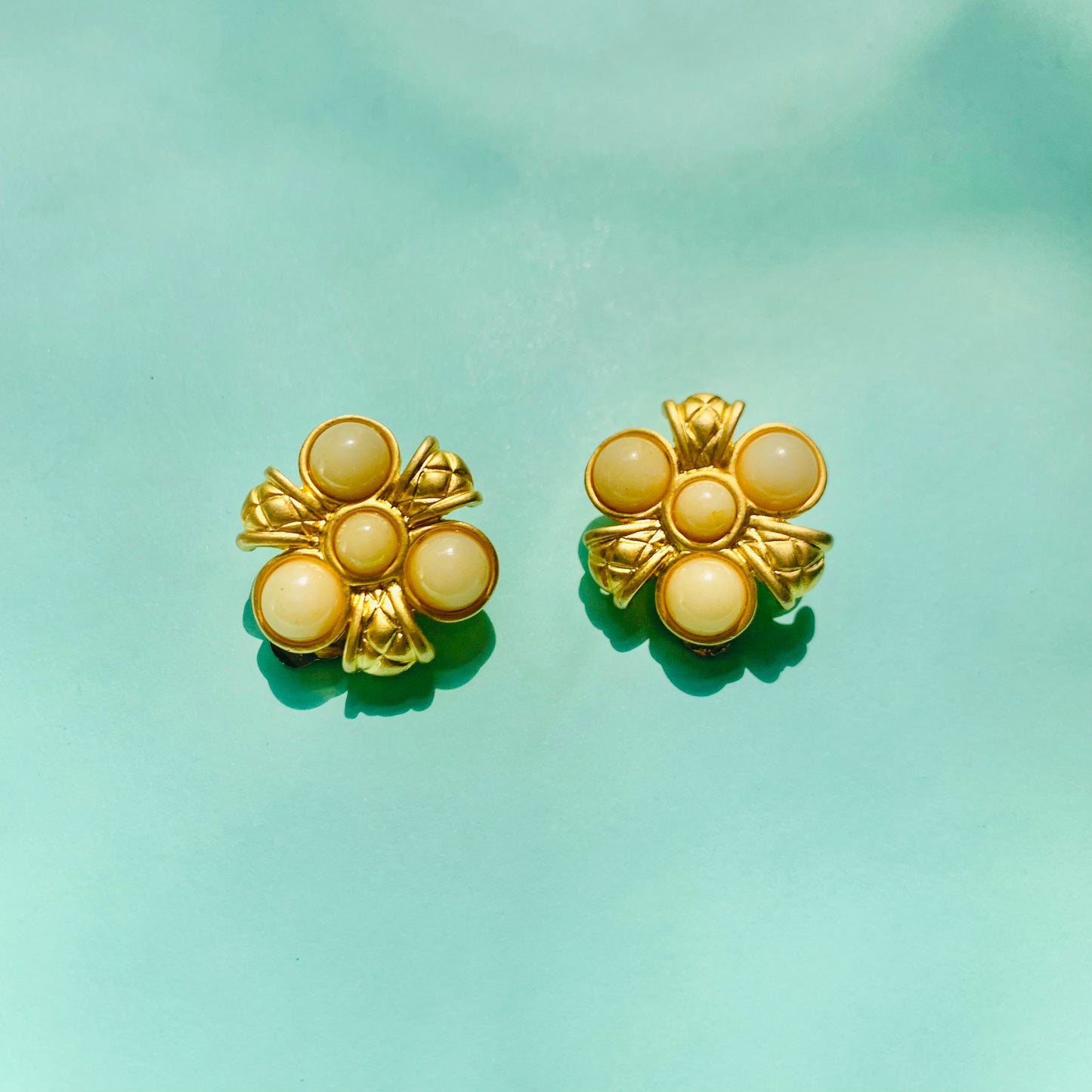 Rare 1980s matte triple gold plated gold matte pearl flower clip on earrings by Monet