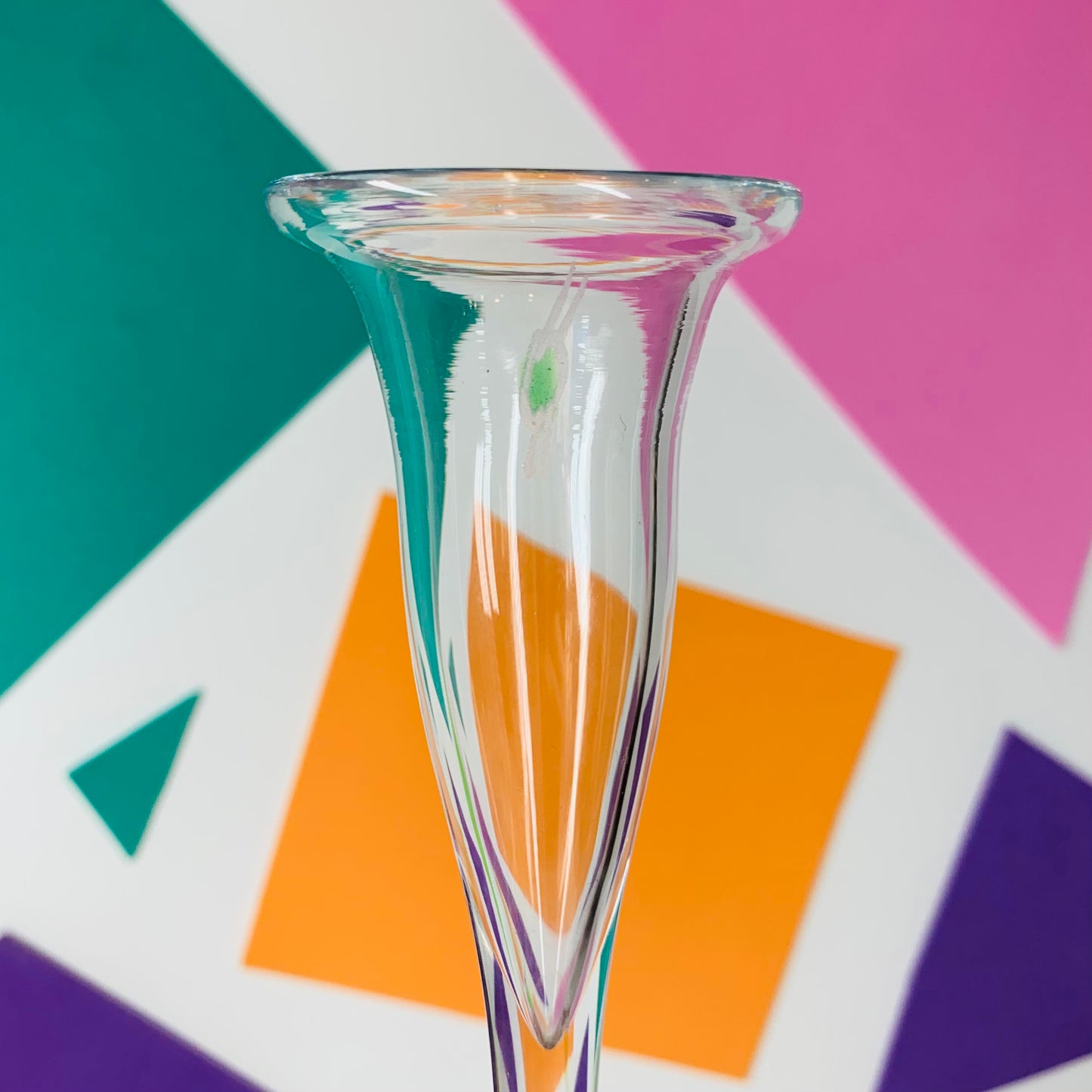 Clear champagne flutes with green mark