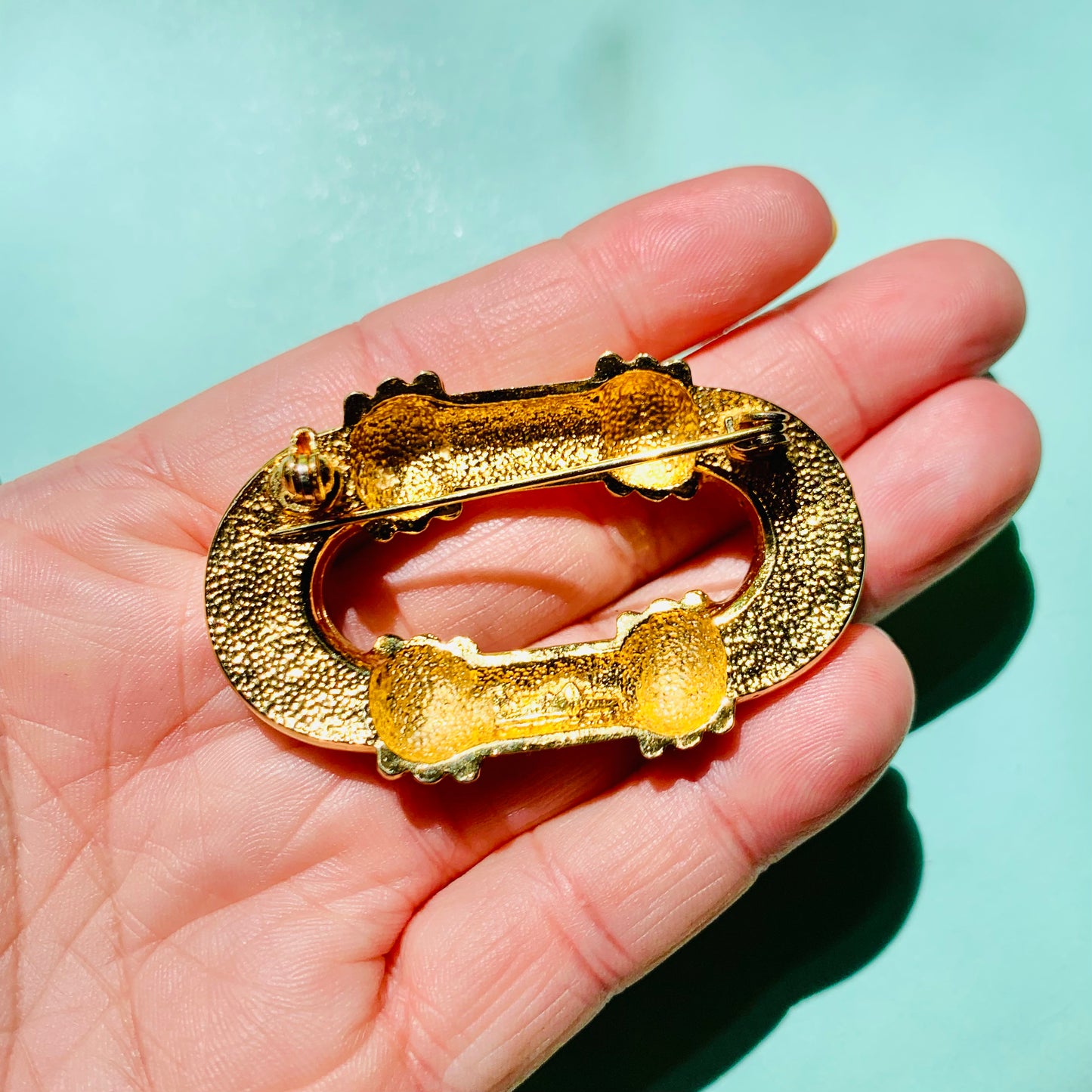 Extremely extremely rare 1980s gold plated buckle brooch by David Gross