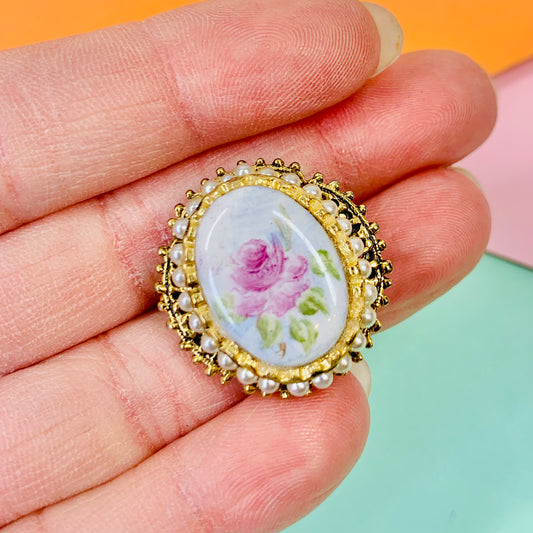 Antique gilt metal brooch with seed pearls and hand painted rose porcelain