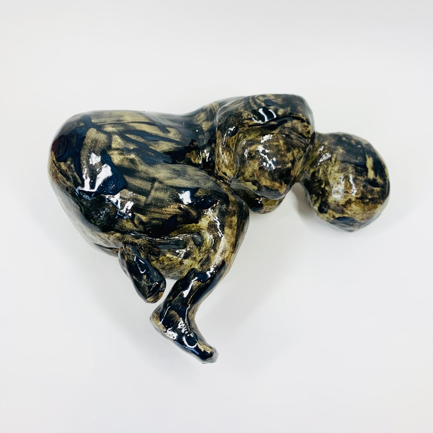 Australian pottery sculpture depicting woman clutching her stomach
