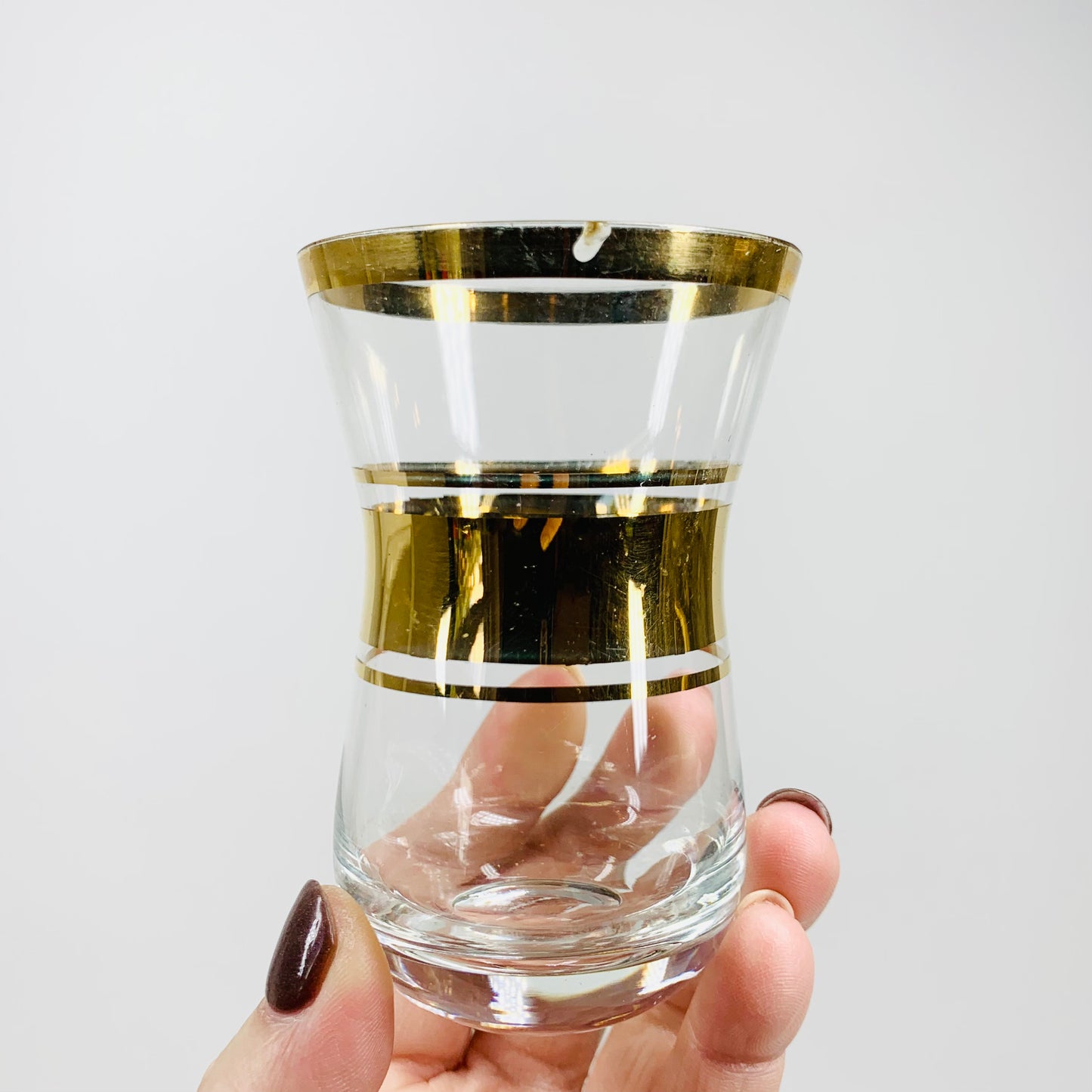 Midcentury gold gilded shot glasses