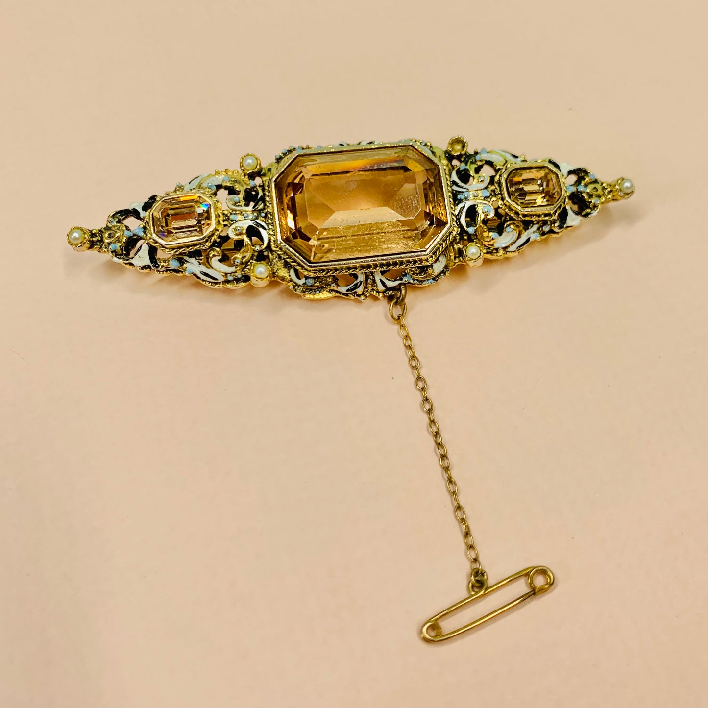 Antique rolled gold enamelled brooch with citrine centre stones and seed pearl and