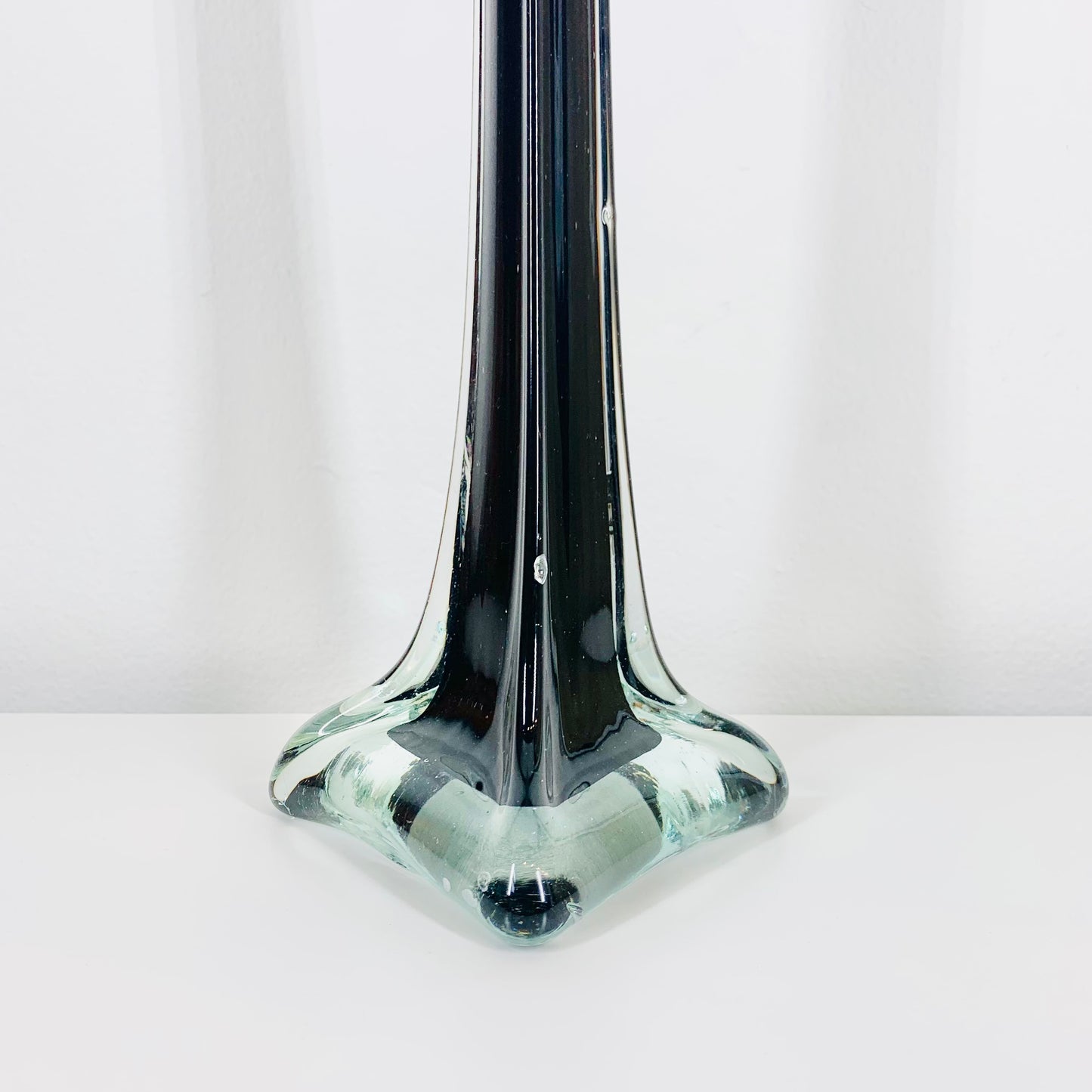 Very tall midcentury black glass vase