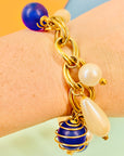 1980s costume gold plated charm bracelet with pearls & blue beads