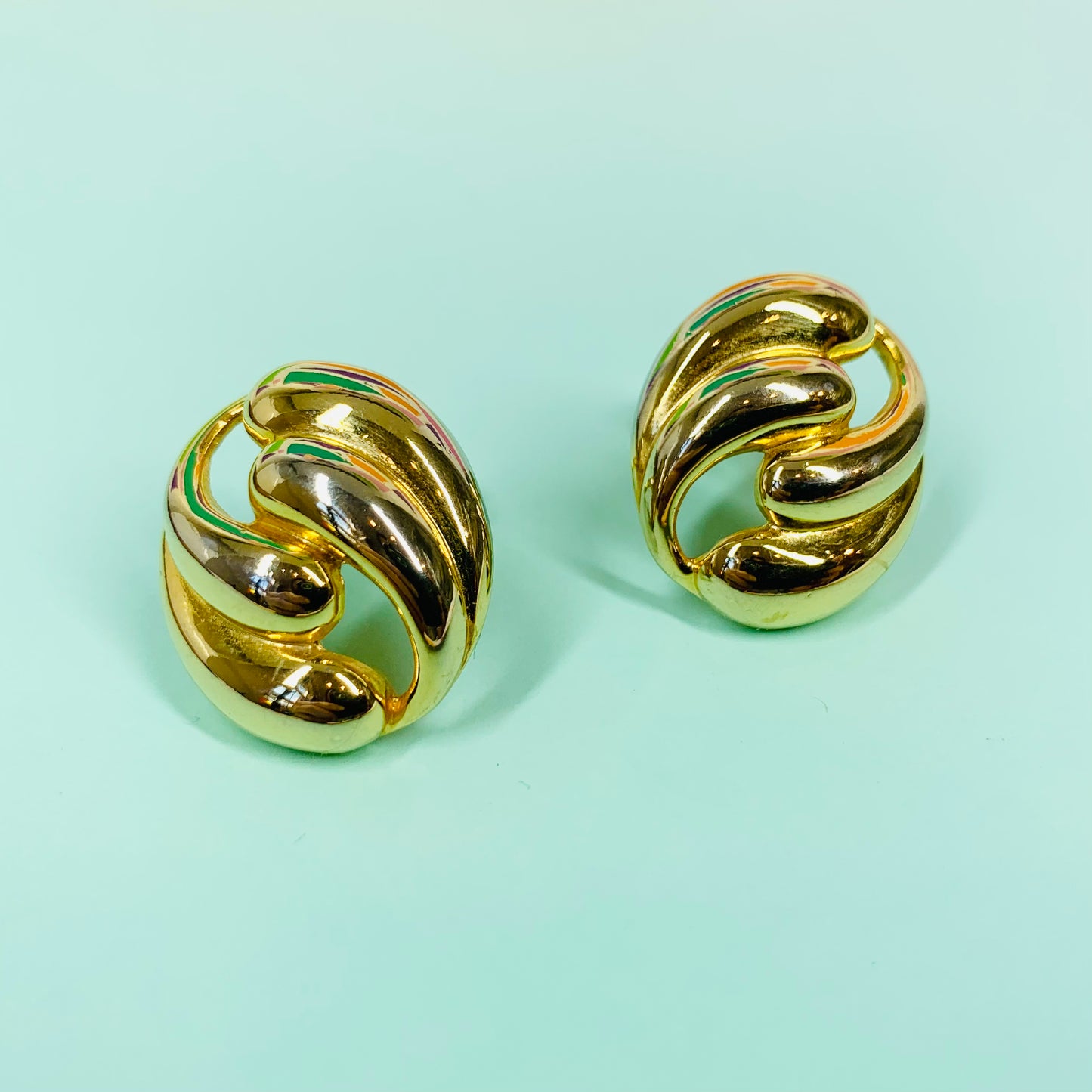 Rare 1980s triple gold plated waves knot clip on earrings by Monet