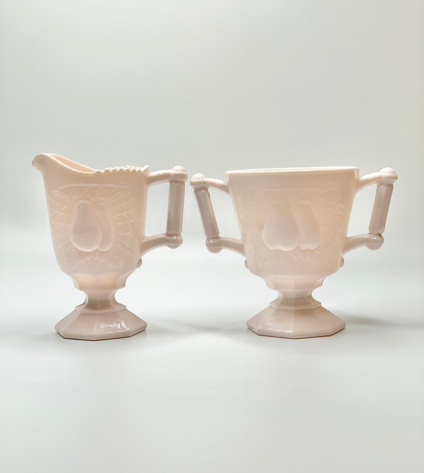 Antique American pink milk glass creamer and or sugar bowl