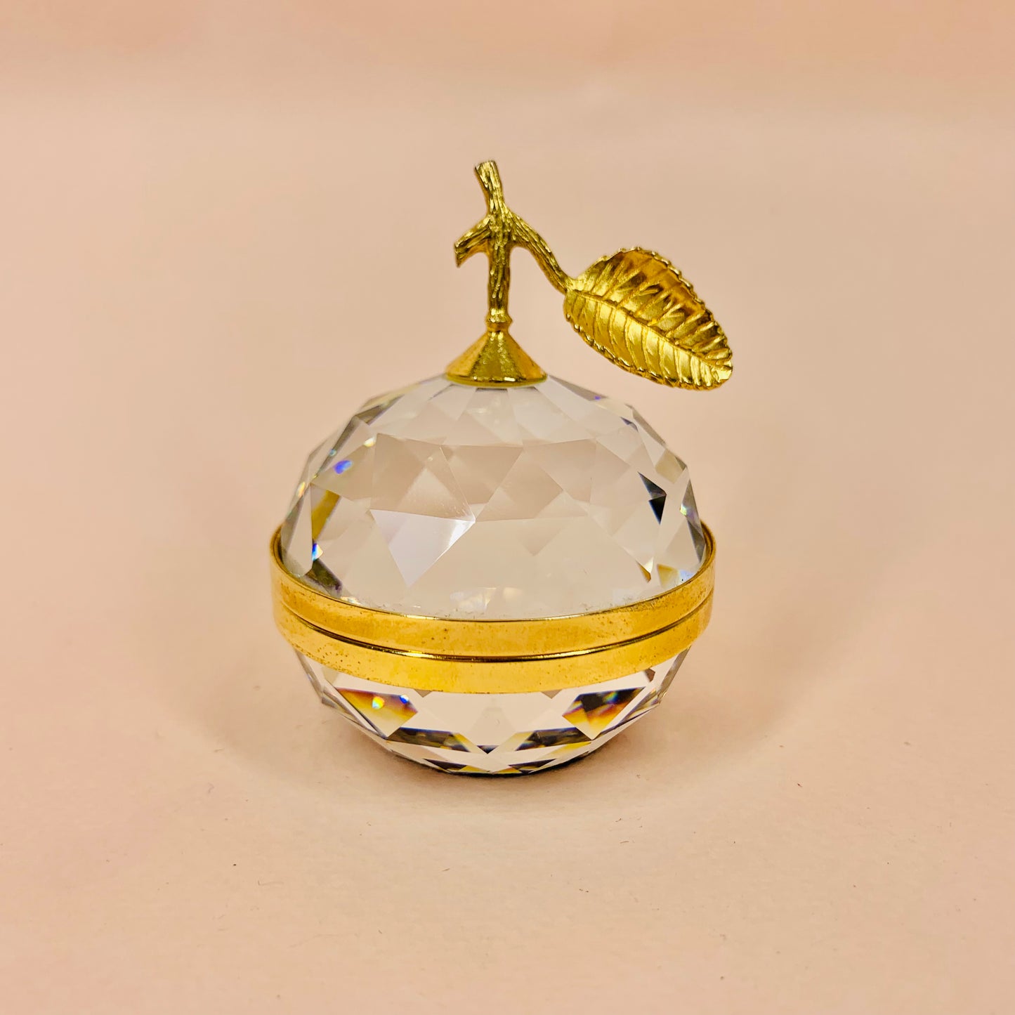 Vintage Bohemian faceted crystal apple with brass gilding