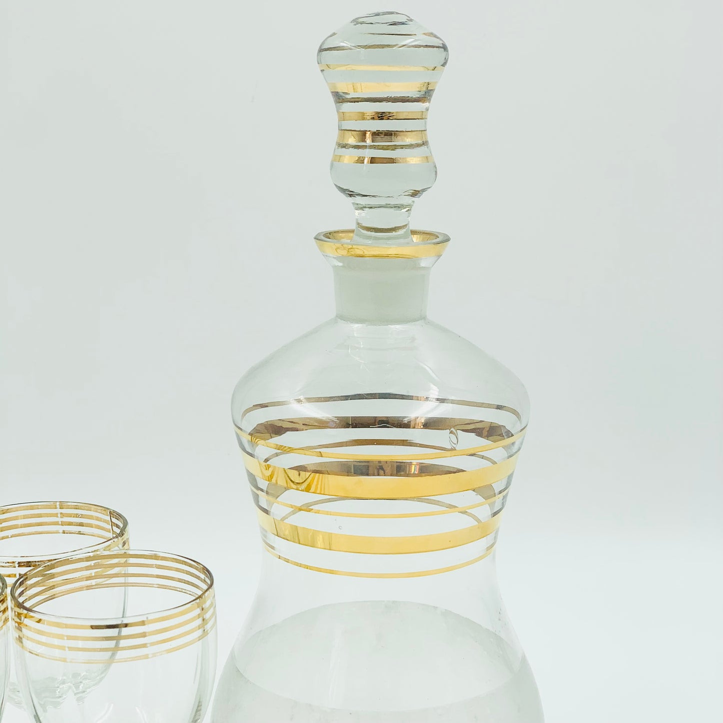 Midcentury decanter glass set with gold bands