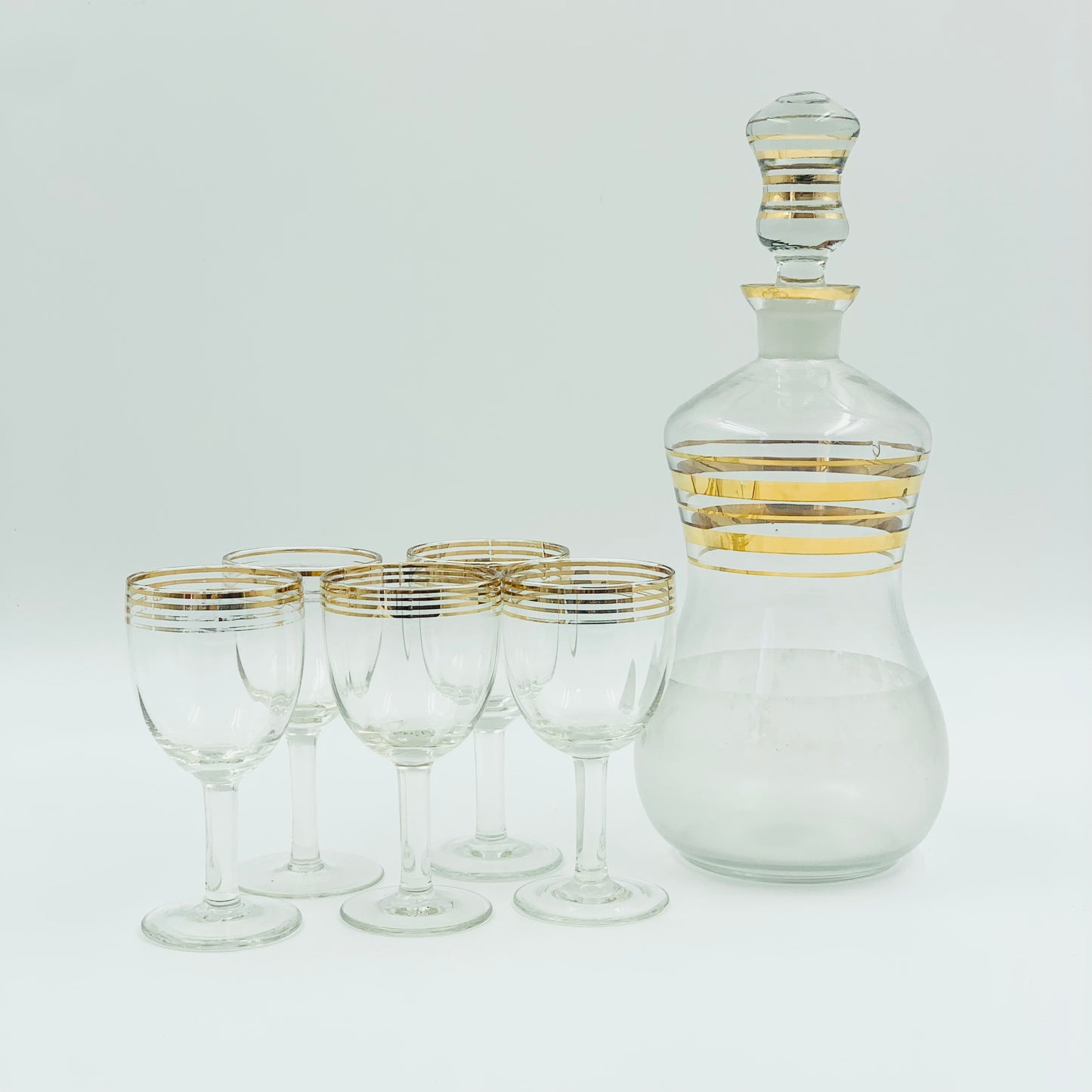 Midcentury decanter glass set with gold bands
