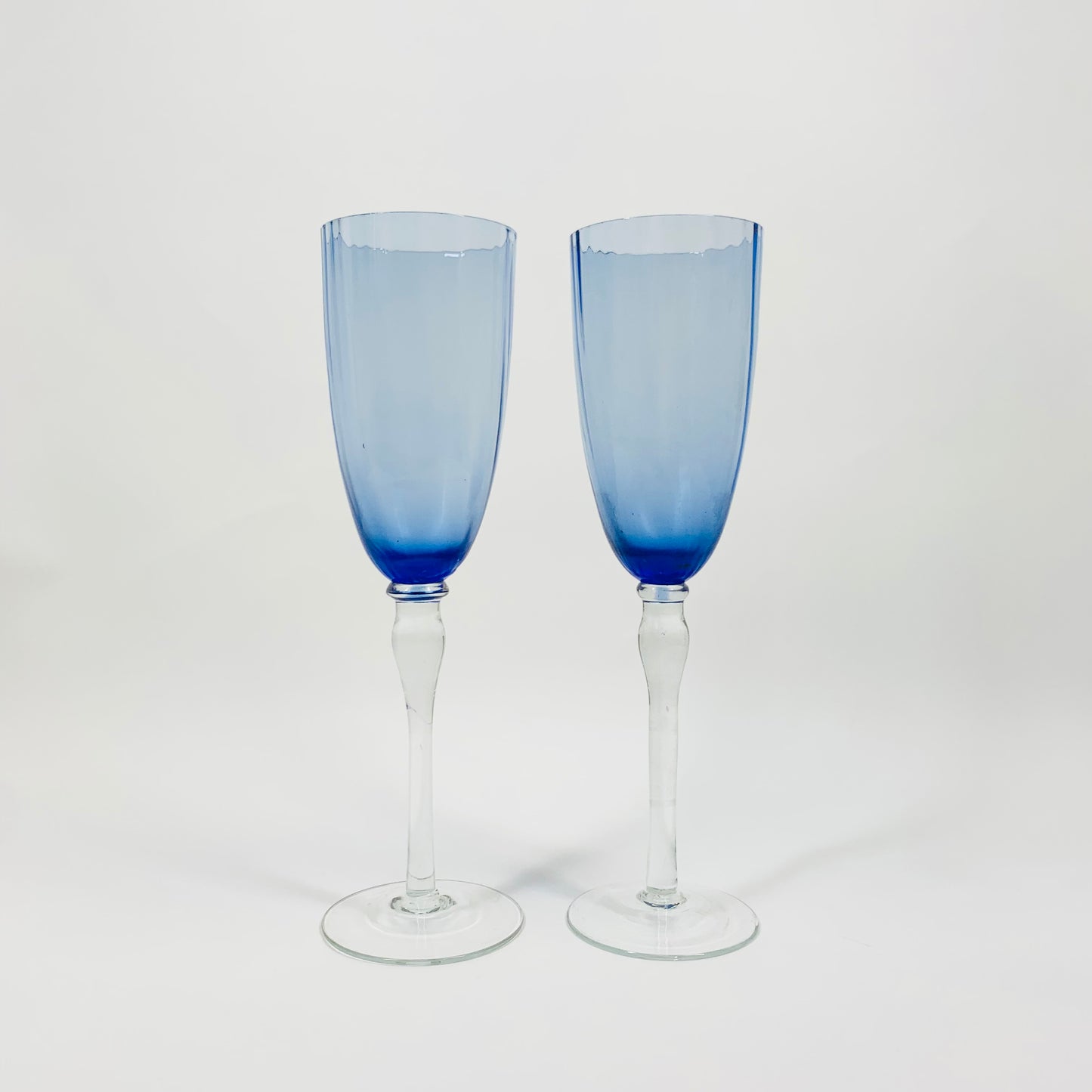 MCM blue glass champagne flutes with clear stems