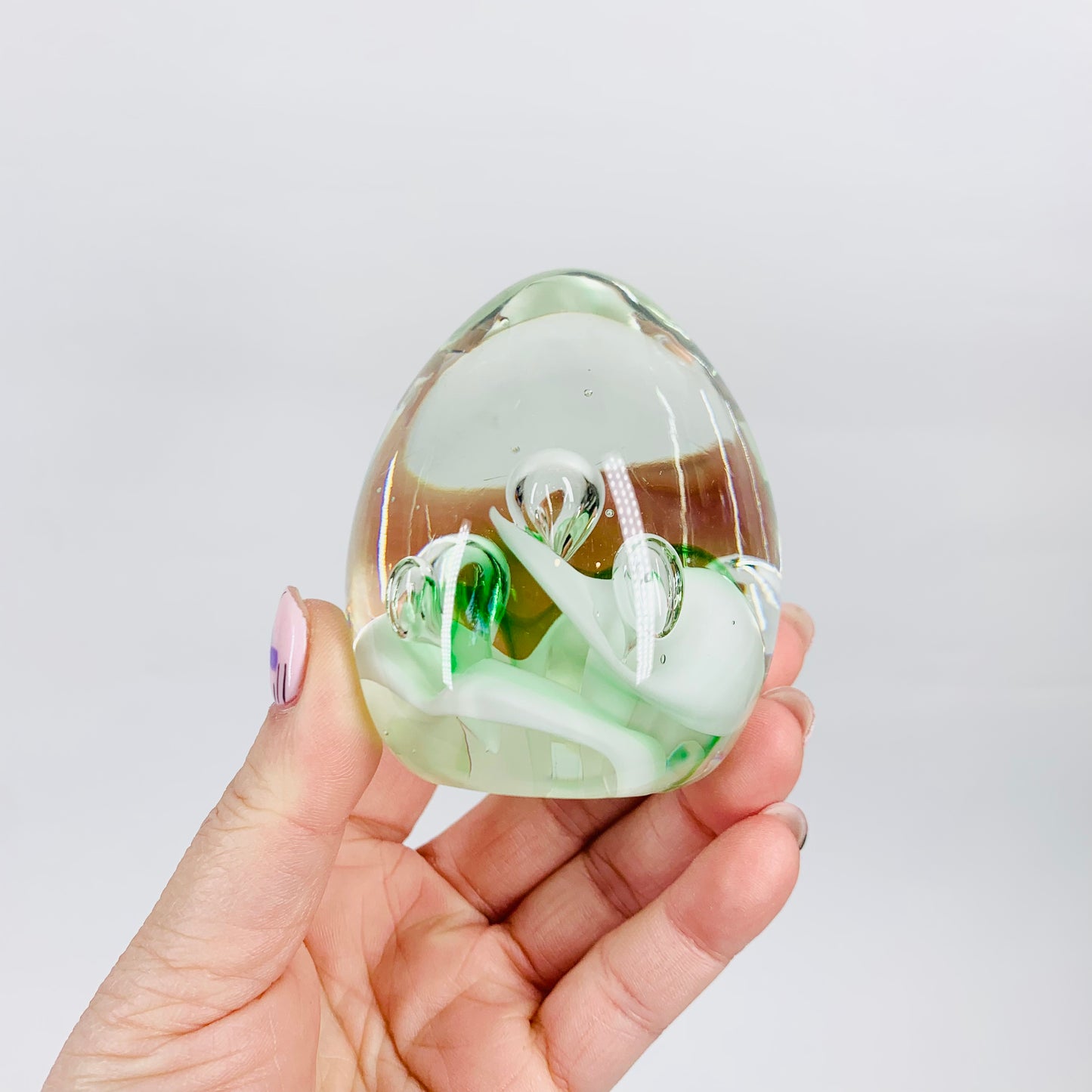 Space Age white and green abstract glass paperweight with controlled bubble