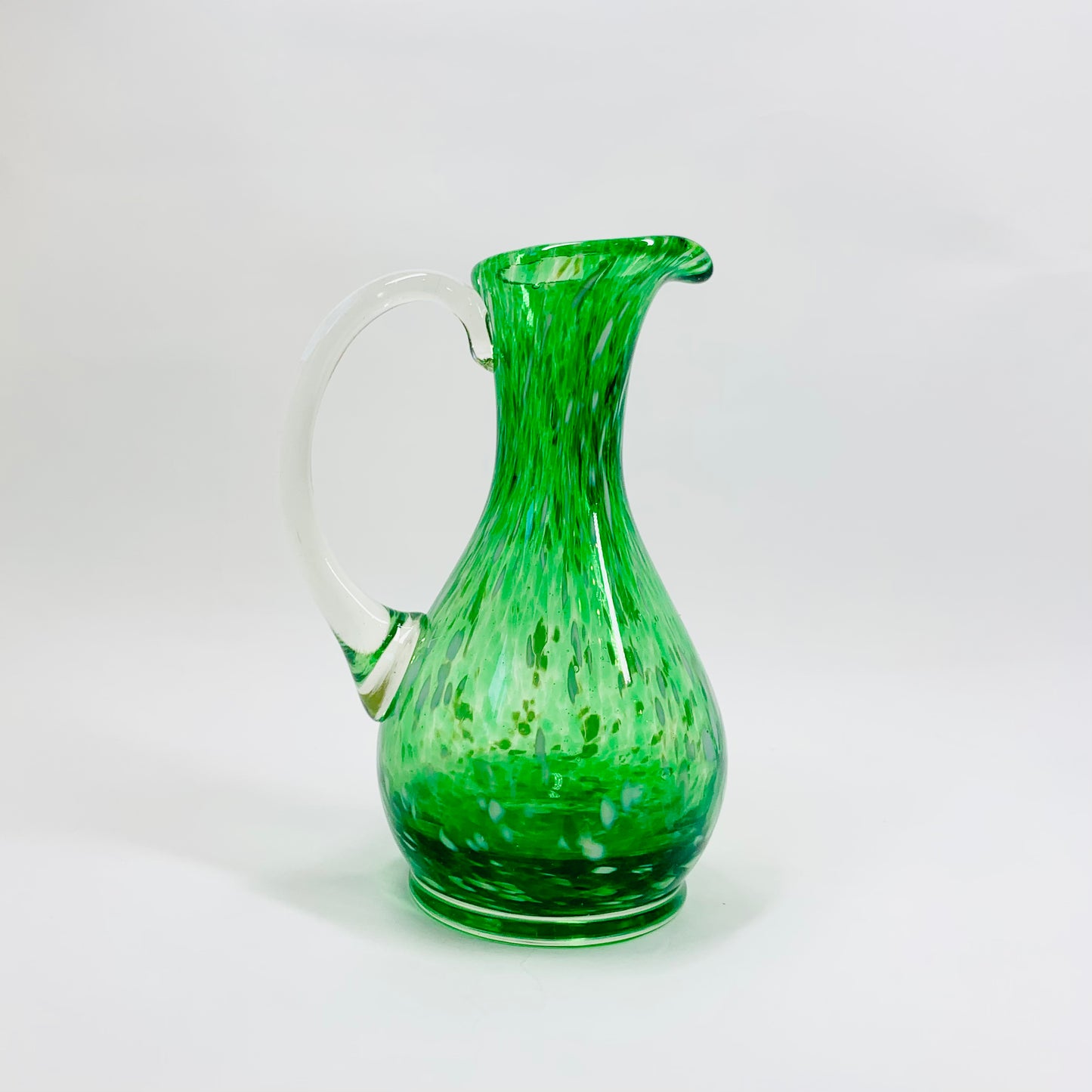 Midcentury mouth blown Italian green speckle glass jug with clear handle