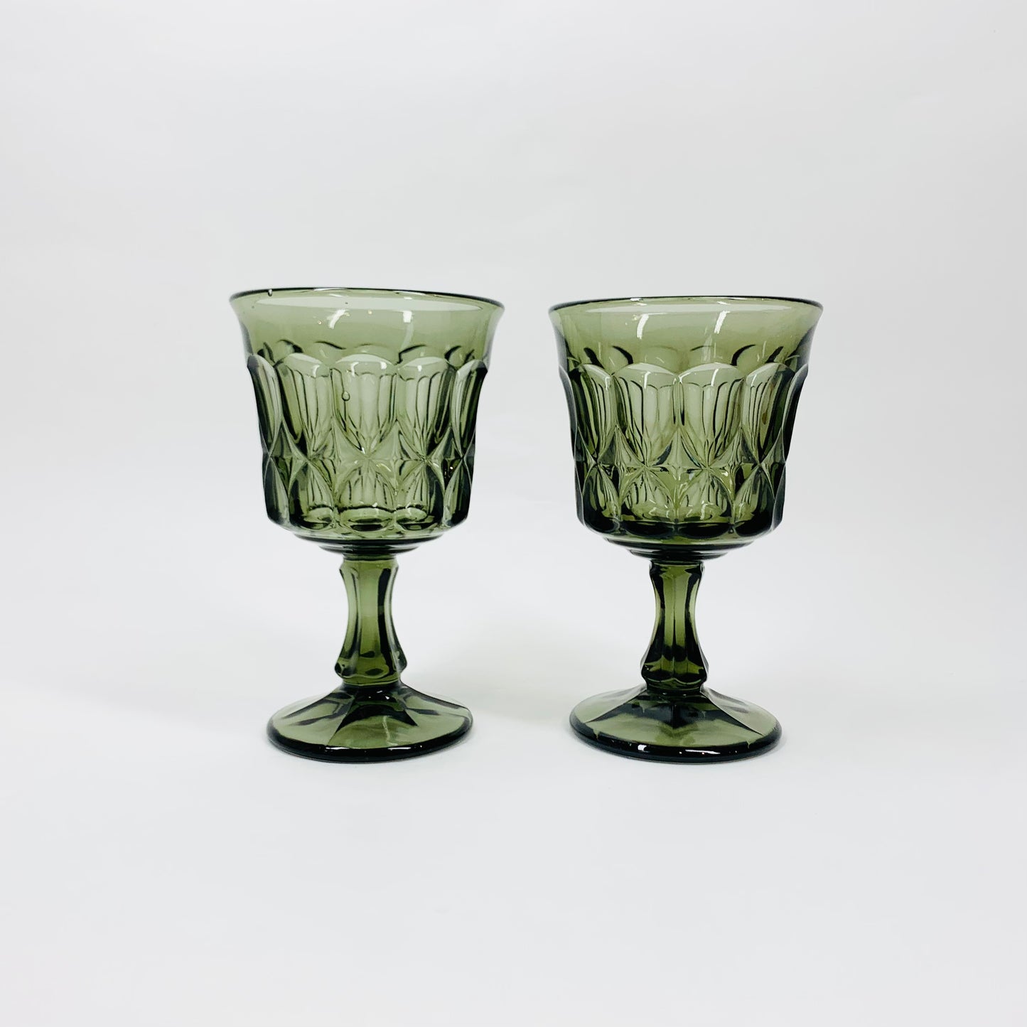Antique Depression grey pressed glass goblets by Jeannette Glass Company