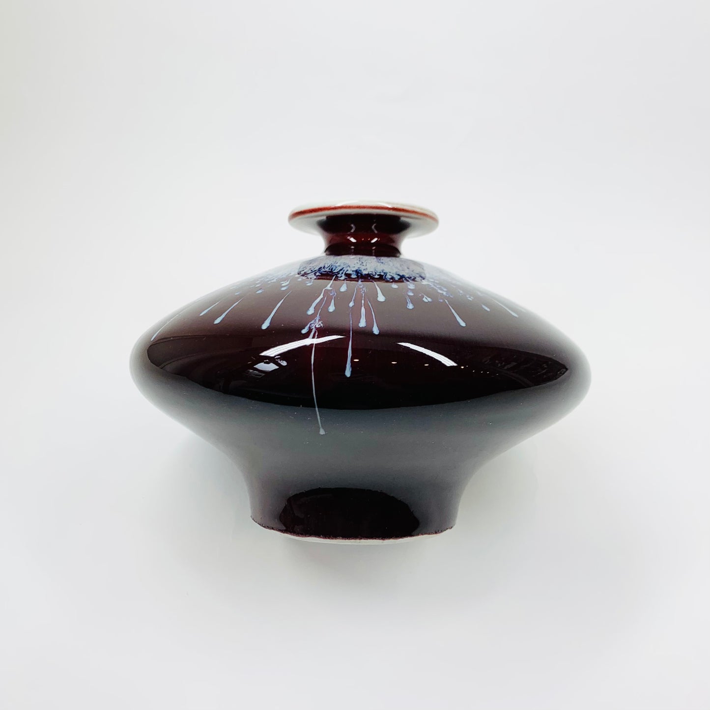 Vintage Chinese maroon bleed flambé pottery squat vase