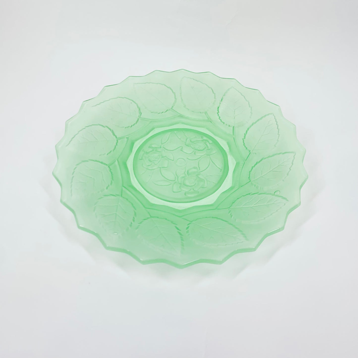 Antique uranium glass plate with leaves motif