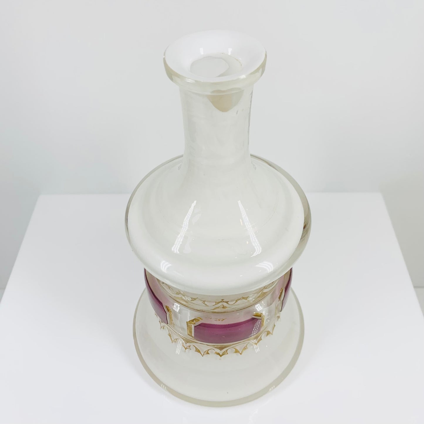 Antique cased white glass bottle vase with gold and purple gilding