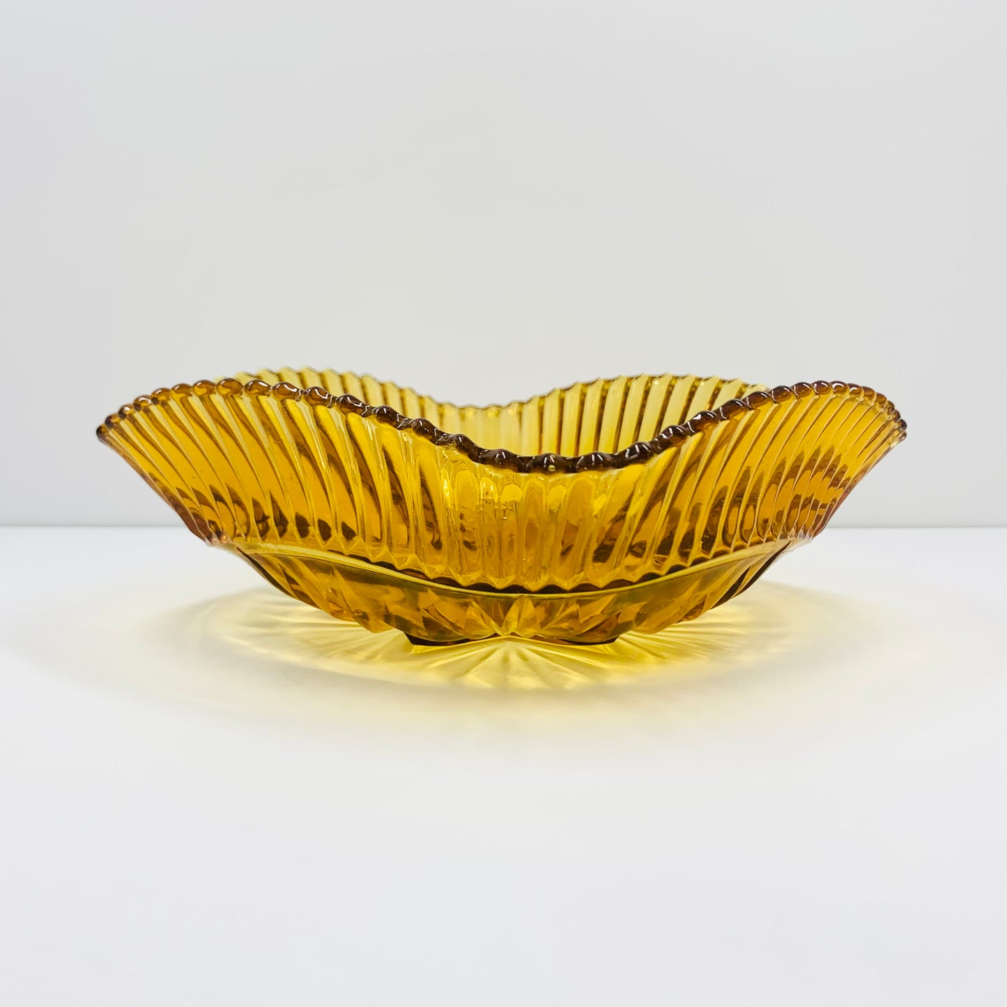 Art Deco amber glass bowl star pattern