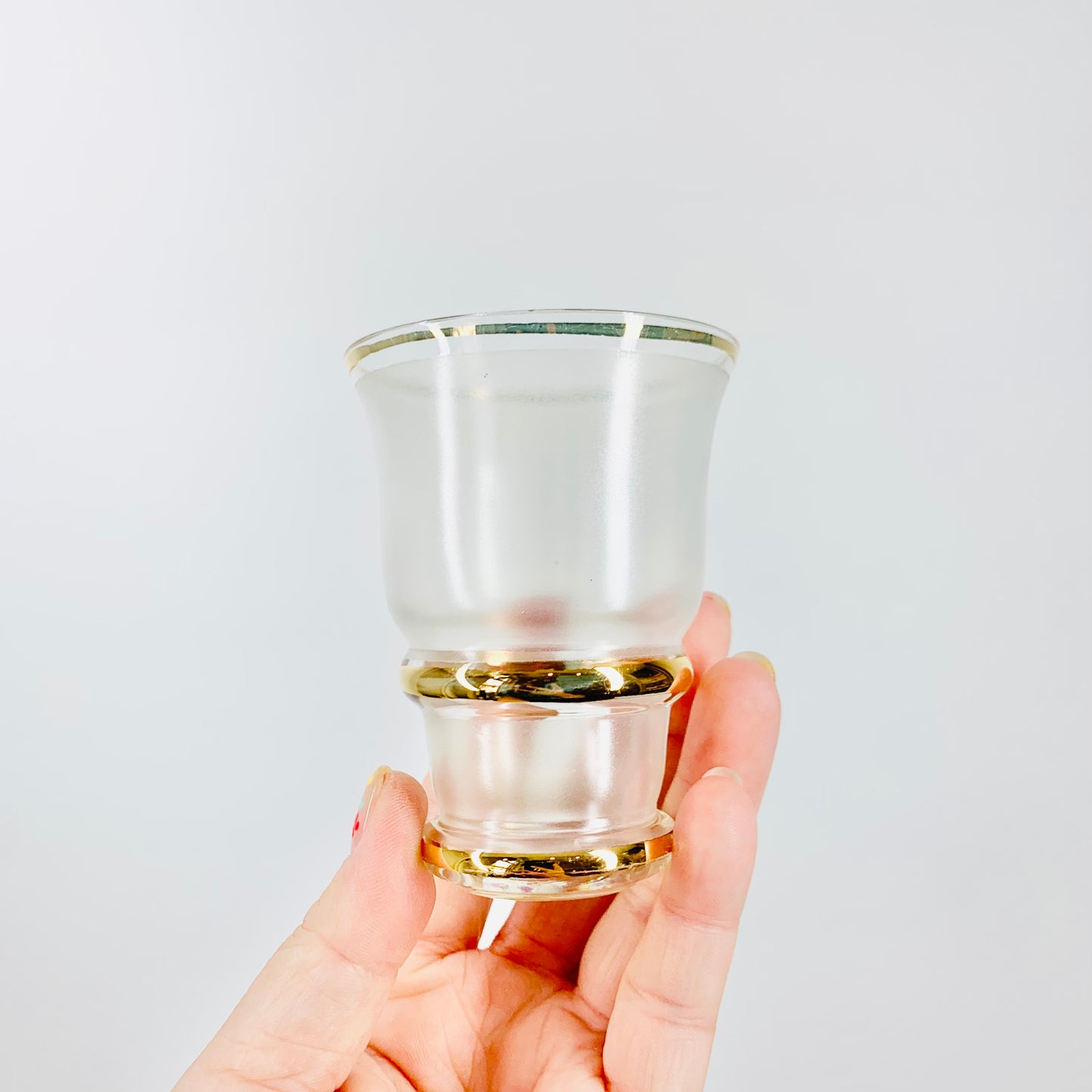 Midcentury white satin shot glasses with gold gilding