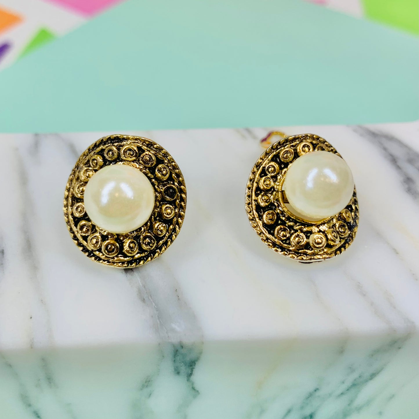1960s gold plated filigree clip on pearl button earrings with filigree border
