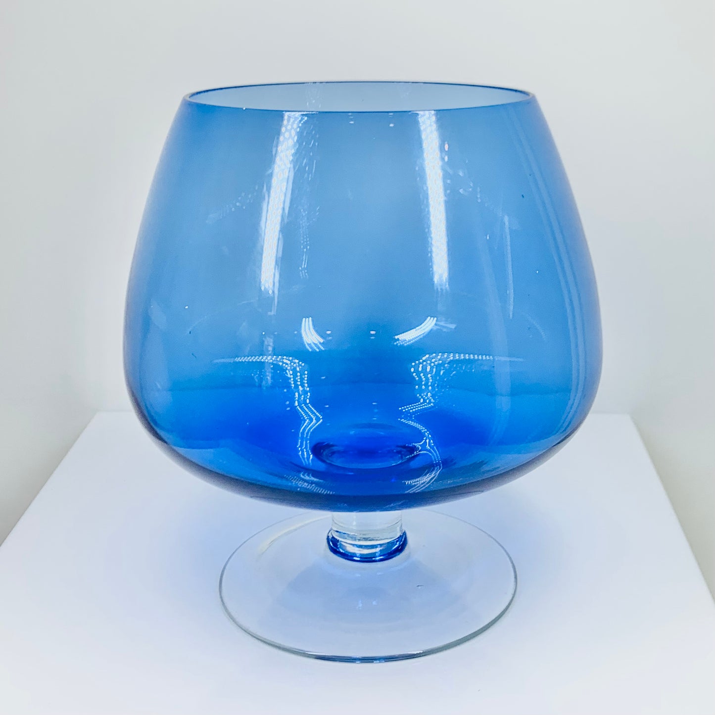 Large Midcentury Italian blue glass brandy balloon vase with clear stem