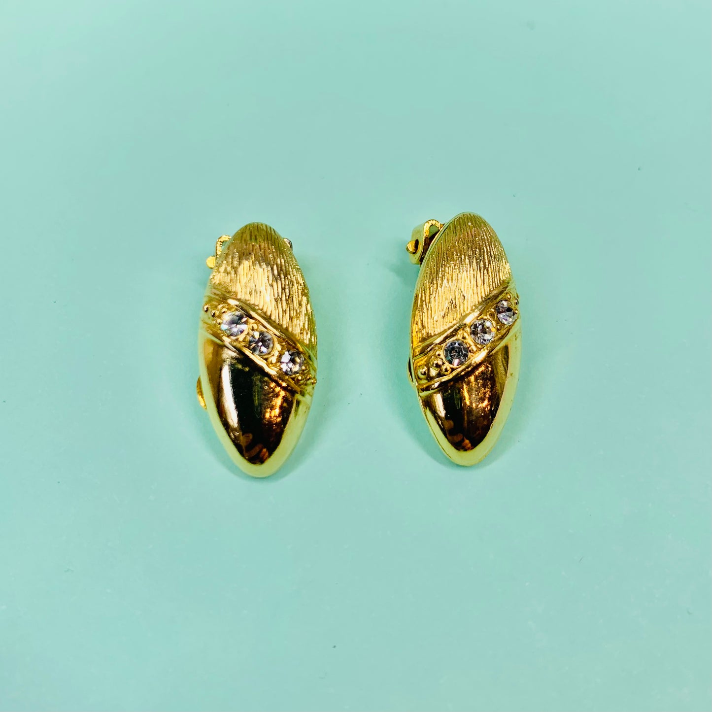 Rare 1960s triple gold plated bean clip on earrings by Monet
